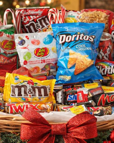 Assorted snacks - chocolates, crisps, and protein bars